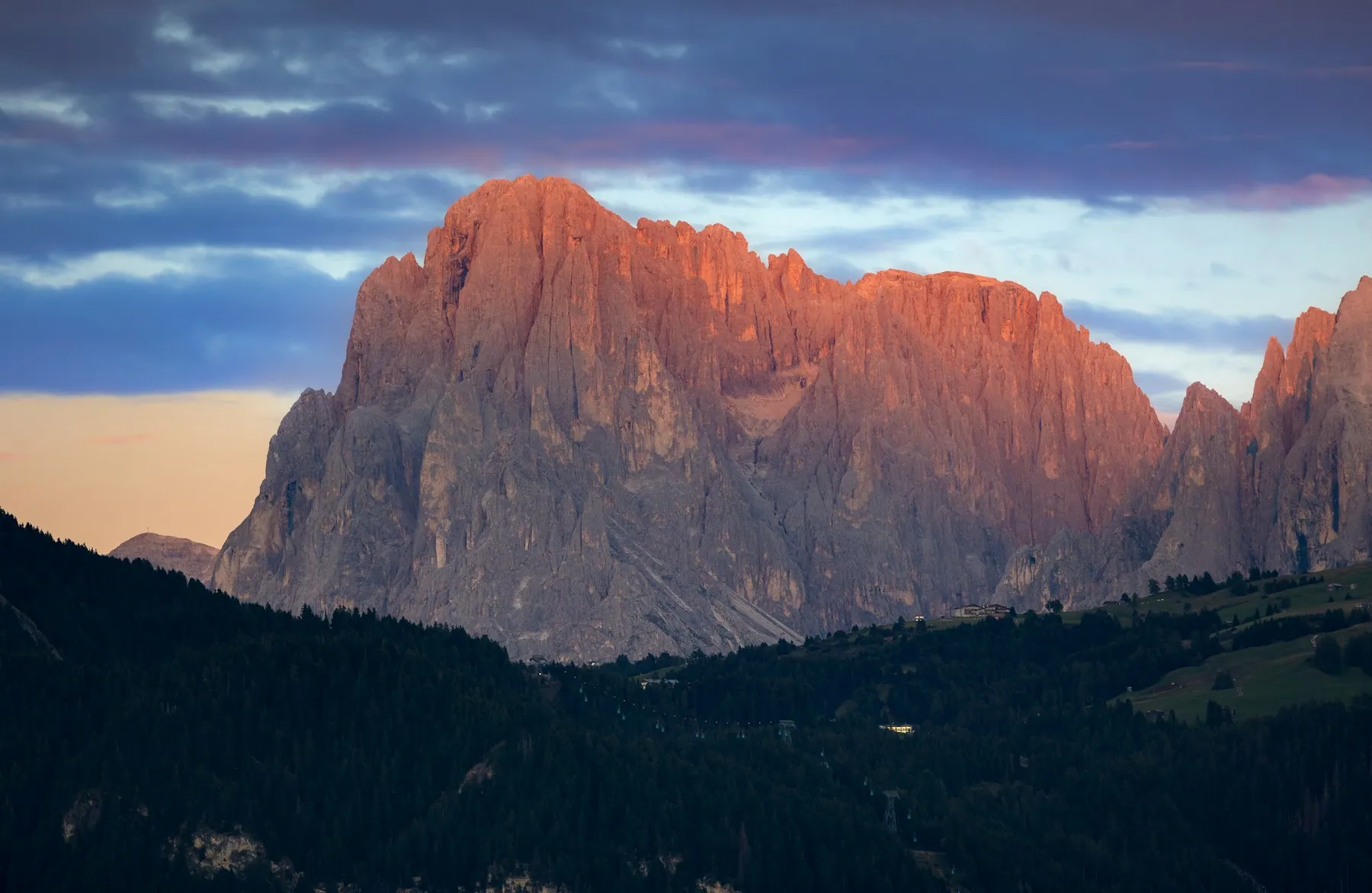 A Dolomites mountain peak glowing at golden hour, Italy