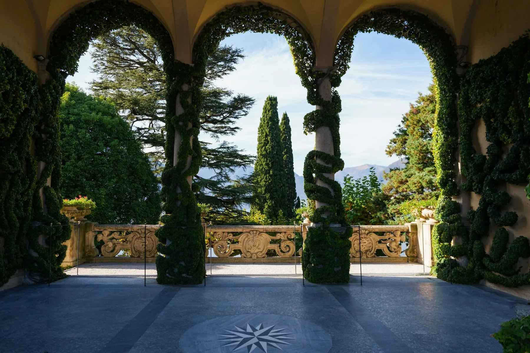 A cypress-lined villa terrace on Lake Como, Italy