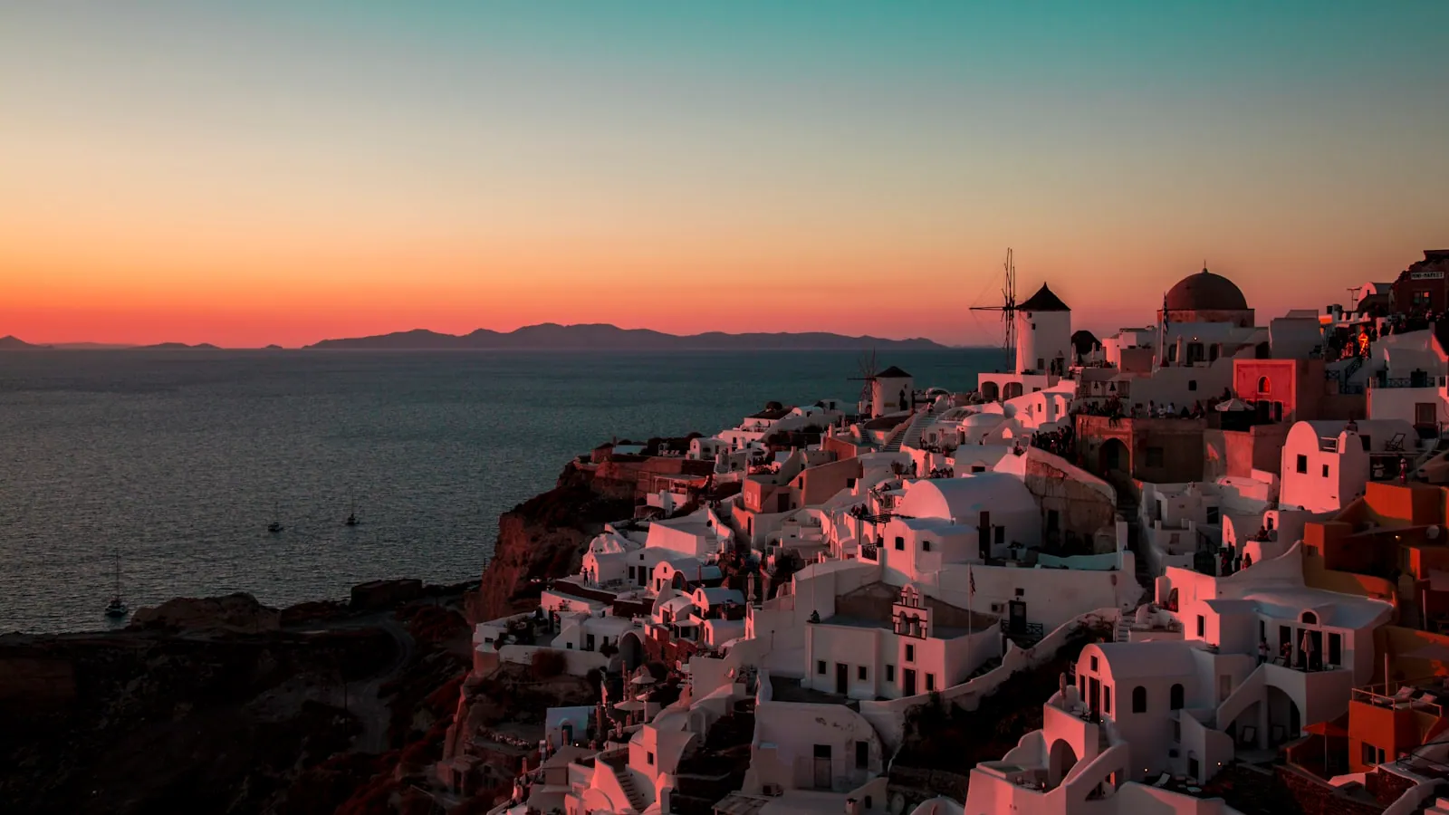 Aerial view of a colourful clifftop village in Santorini, Greece